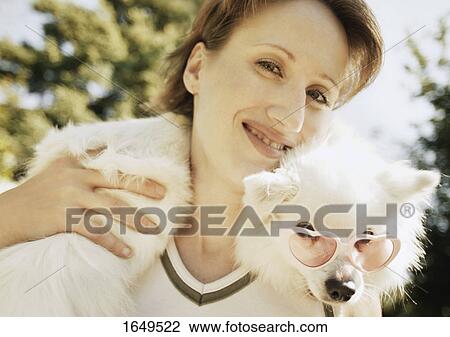 Stock Image - Woman with dog. Fotosearch