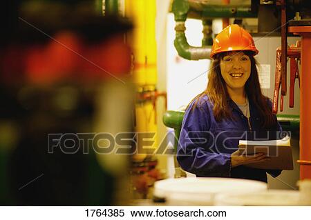 Stock Photography - Woman with hard hat. Fotosearch