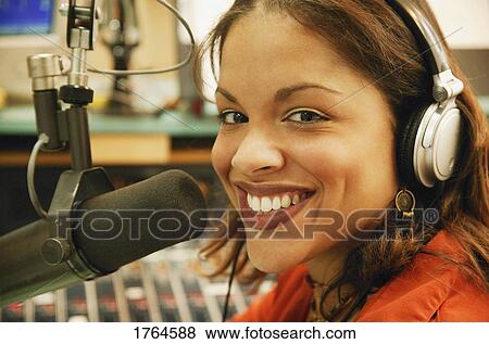 Stock Photo - Woman with microphone. Fotosearch