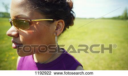 Stock Image - Woman with sunglasses. Fotosearch