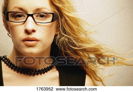 Woman with trendy glasses View Large Photo Image Stock Image - Woman with trendy glasses. Fotosearch