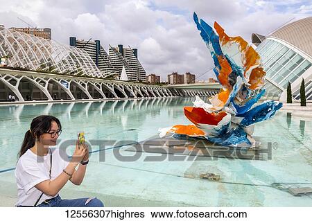 Stock Photograph - Young female tourist at City of Arts and Sciences; Valencia, Spain. Fotosearch