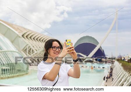 Young female tourist at City of Arts and Sciences; Valencia, Spain View Large Photo Image Stock Photograph - Young female tourist at City of Arts and Sciences; Valencia, Spain. Fotosearch