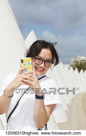 Young female tourist at City of Arts and Sciences; Valencia, Spain View Large Photo Image Stock Photograph - Young female tourist at City of Arts and Sciences; Valencia, Spain. Fotosearch