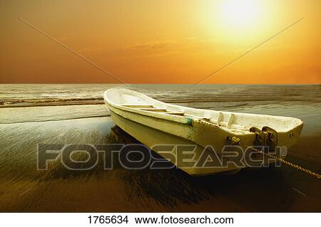 A boat sits on shore View Large Photo Image Picture - A boat sits on shore. Fotosearch