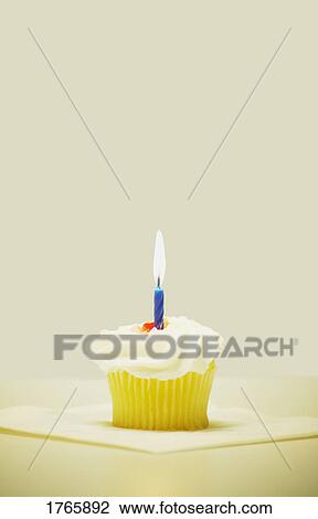 A cupcake with a candle View Large Photo Image Stock Image - A cupcake with a candle. Fotosearch
