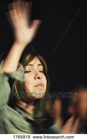 Stock Photo - A girl worshipping. Fotosearch