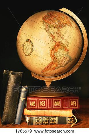 Stock Photo - A globe and books. Fotosearch
