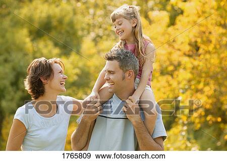 Stock Photograph - A happy family. Fotosearch - Search Stock Photography, Posters, Pictures, and Photo Clipart Images