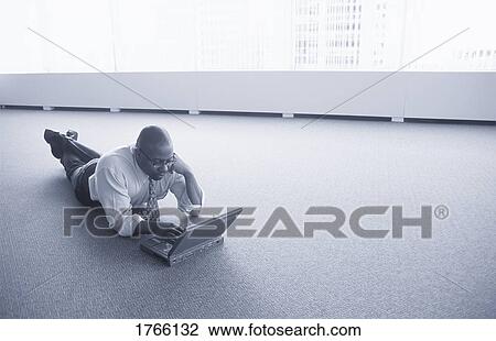 Stock Image - A man with lap top computer. Fotosearch