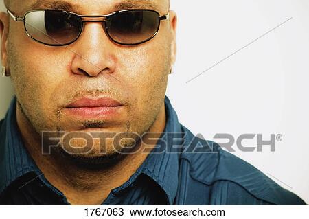 Stock Image - A man with sunglasses. Fotosearch