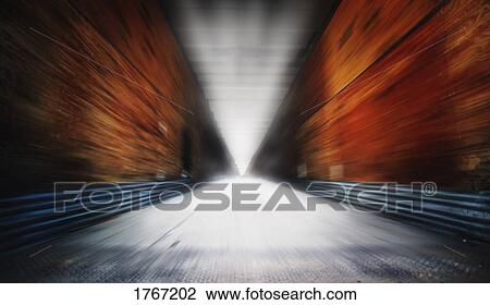 A pathway with light at the end View Large Photo Image Stock Image - A pathway with light at the end. Fotosearch