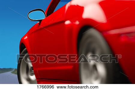 Stock Photograph - A red car on the road. Fotosearch