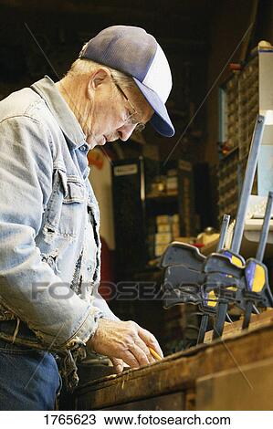 Stock Photo - A senior working. Fotosearch - Search Stock Images, Poster Photographs, Pictures, and Clip Art Photos