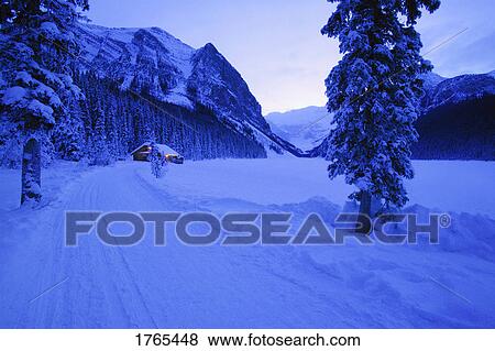 Stock Photo - A small cabin in a winter wonderland. Fotosearch