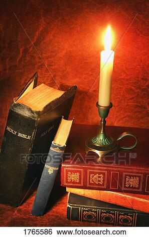Books and candle View Large Photo Image Stock Photograph - Books and candle. Fotosearch