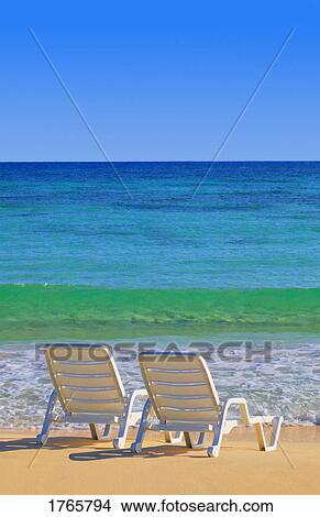 Chairs on a beach View Large Photo Image Picture - Chairs on a beach. Fotosearch