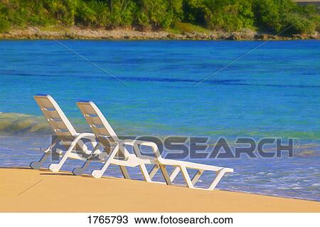 Stock Image - Chairs on a beach. Fotosearch