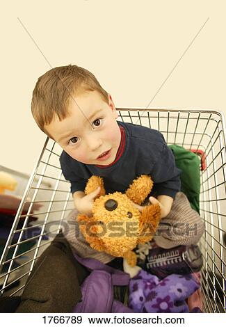 Child in a shopping cart View Large Photo Image Stock Photo - Child in a shopping cart. Fotosearch