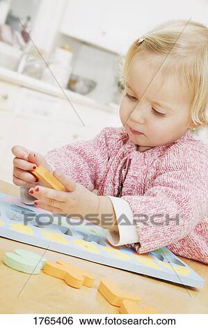Child plays with alphabet View Large Photo Image Stock Photograph - Child plays with alphabet. Fotosearch