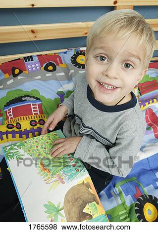 Child with book View Large Photo Image Stock Photo - Child with book. Fotosearch