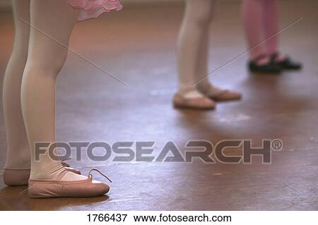 Close-up of children's ballet slippers and feet View Large Photo Image Stock Photo - Close-up of children's ballet slippers and feet. Fotosearch