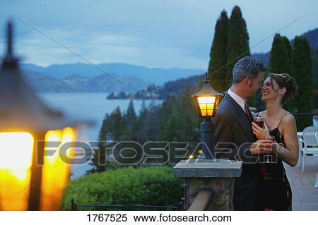 Stock Photography - Couple enjoy each other's company. Fotosearch