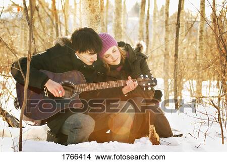 Picture - Couple listen to music. Fotosearch