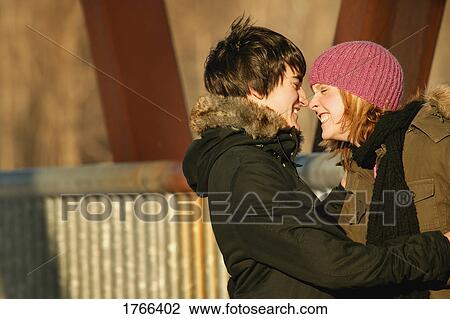 Stock Image - Couple share a laugh. Fotosearch