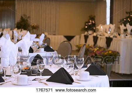 Stock Image - Formal place settings at Wedding Banquet. Fotosearch