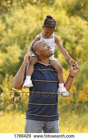Stock Photo - Fun with dad. Fotosearch