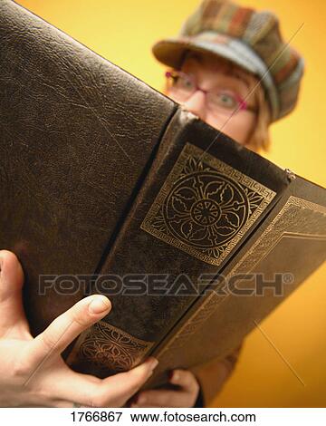 Girl reads a book View Large Photo Image Stock Photo - Girl reads a book. Fotosearch
