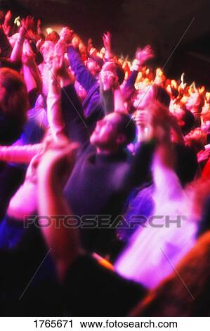Stock Image - Group at a concert. Fotosearch