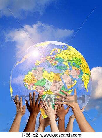 Hands on a globe View Large Photo Image Stock Image - Hands on a globe. Fotosearch