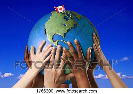 Hands on a globe View Large Photo Image Stock Image - Hands on a globe. Fotosearch