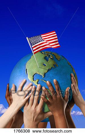 Hands on a globe View Large Photo Image Stock Photo - Hands on a globe. Fotosearch