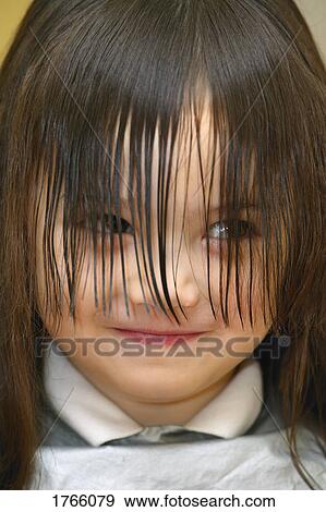 Stock Photo - Little Girl getting a haircut. Fotosearch