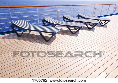 Lounging chairs in a row View Large Photo Image Stock Image - Lounging chairs in a row. Fotosearch