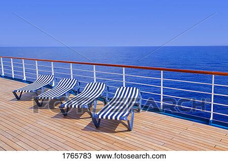 Stock Image - Lounging chairs in a row. Fotosearch