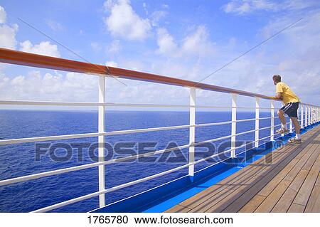 Man looks at water View Large Photo Image Stock Image - Man looks at water. Fotosearch