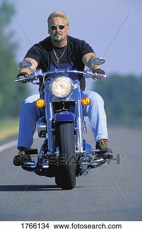 Man on motorbike View Large Photo Image Picture - Man on motorbike. Fotosearch