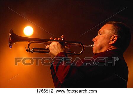 Stock Image - Man plays a trumpet. Fotosearch