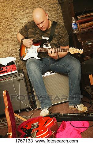 Man plays bass View Large Photo Image Stock Image - Man plays bass. Fotosearch