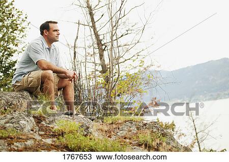 Man sits and reflects View Large Photo Image Stock Image - Man sits and reflects. Fotosearch