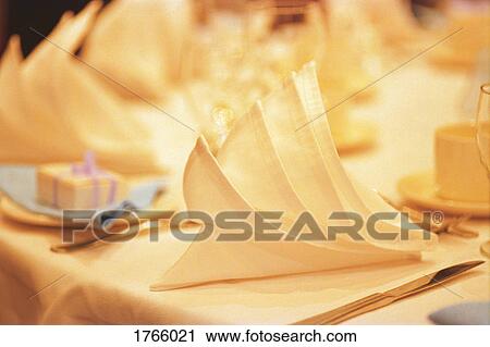 Napkins folded on a table View Large Photo Image Stock Image - Napkins folded on a table. Fotosearch