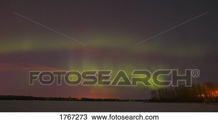 Stock Image - Northern lights over slave lake Alberta Canada. Fotosearch