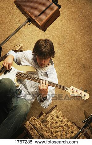 Playing a bass View Large Photo Image Stock Photography - Playing a bass. Fotosearch