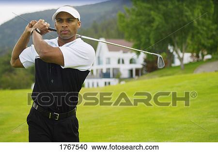 Stock Image - Portrait of a golfer. Fotosearch