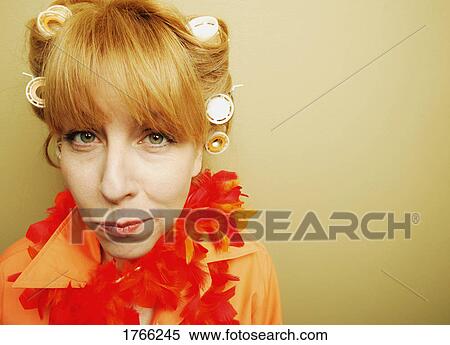 Stock Photography - Portrait of a woman with curlers. Fotosearch