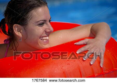 Portrait of young woman in swimming pool View Large Photo Image Picture - Portrait of young woman in swimming pool. Fotosearch